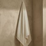 half white bath towel