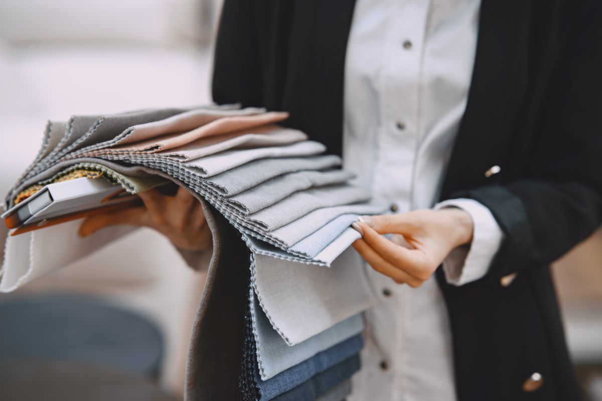 a women while checking the fabric quality