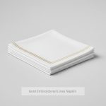 white napkins with golden lines